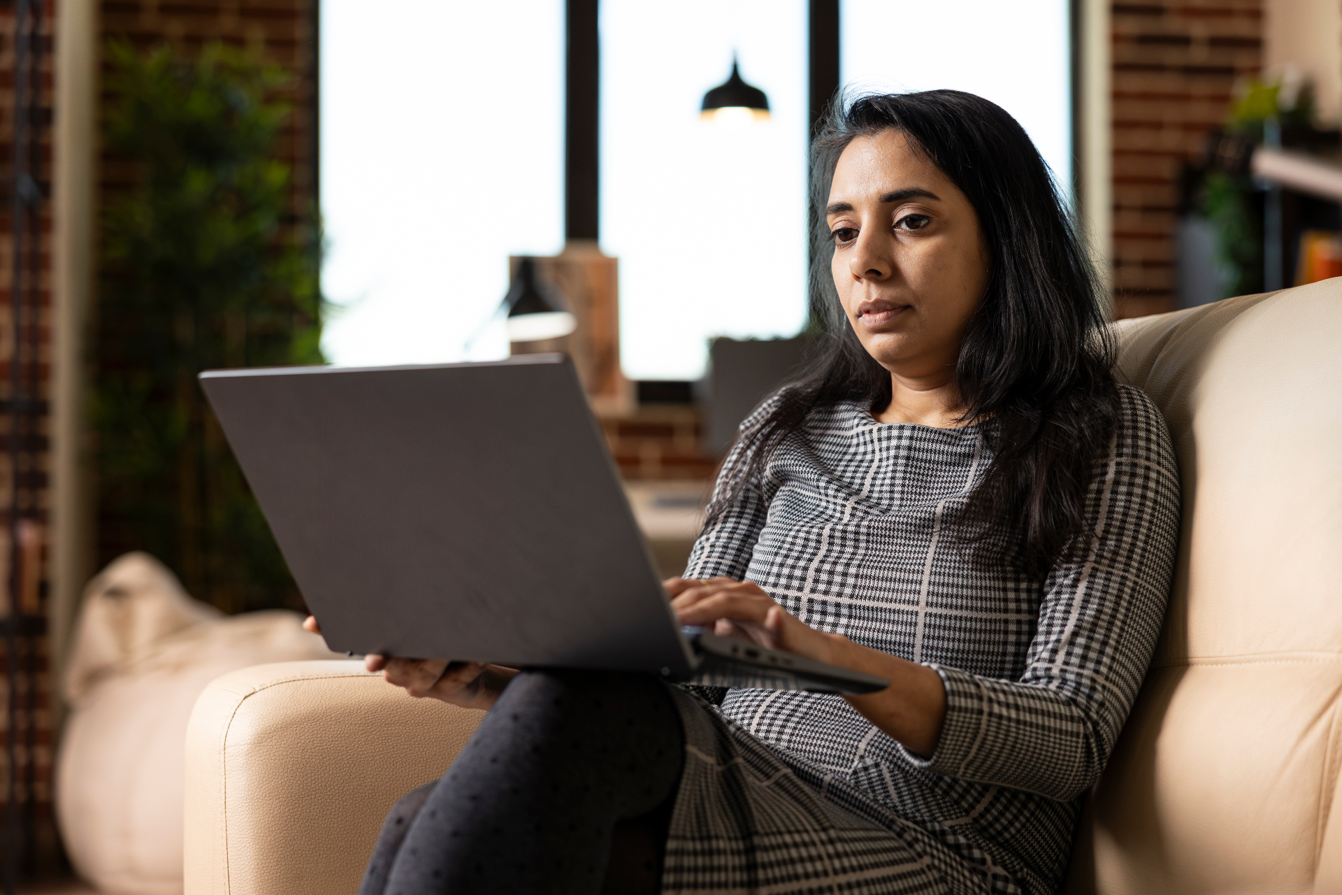 A mature learner using a laptop outdoors